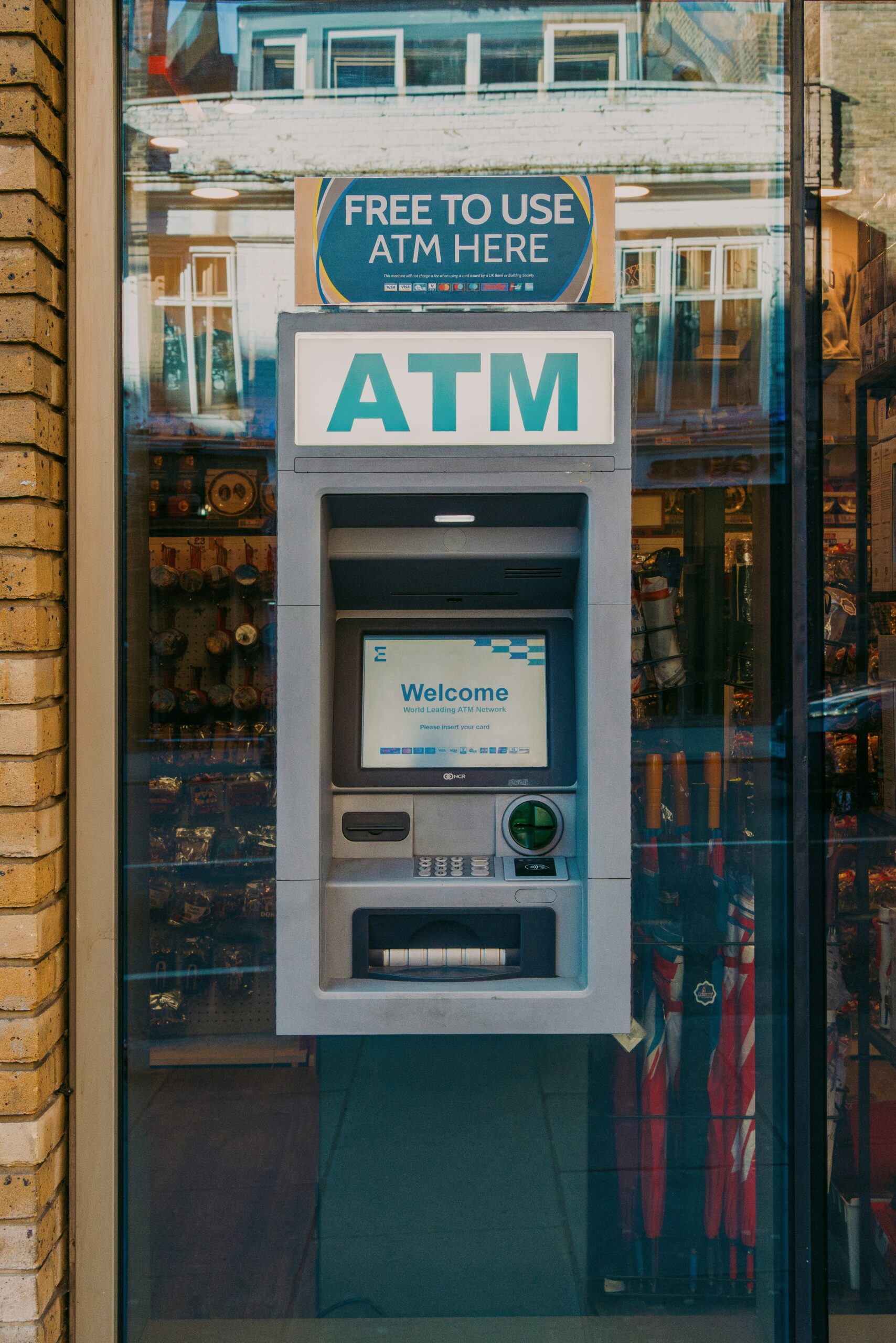 ATM machine abroad with a free-to-use sign that may not include bank or card fees